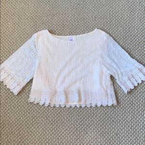 Cream colored sleeved lace cropped blouse